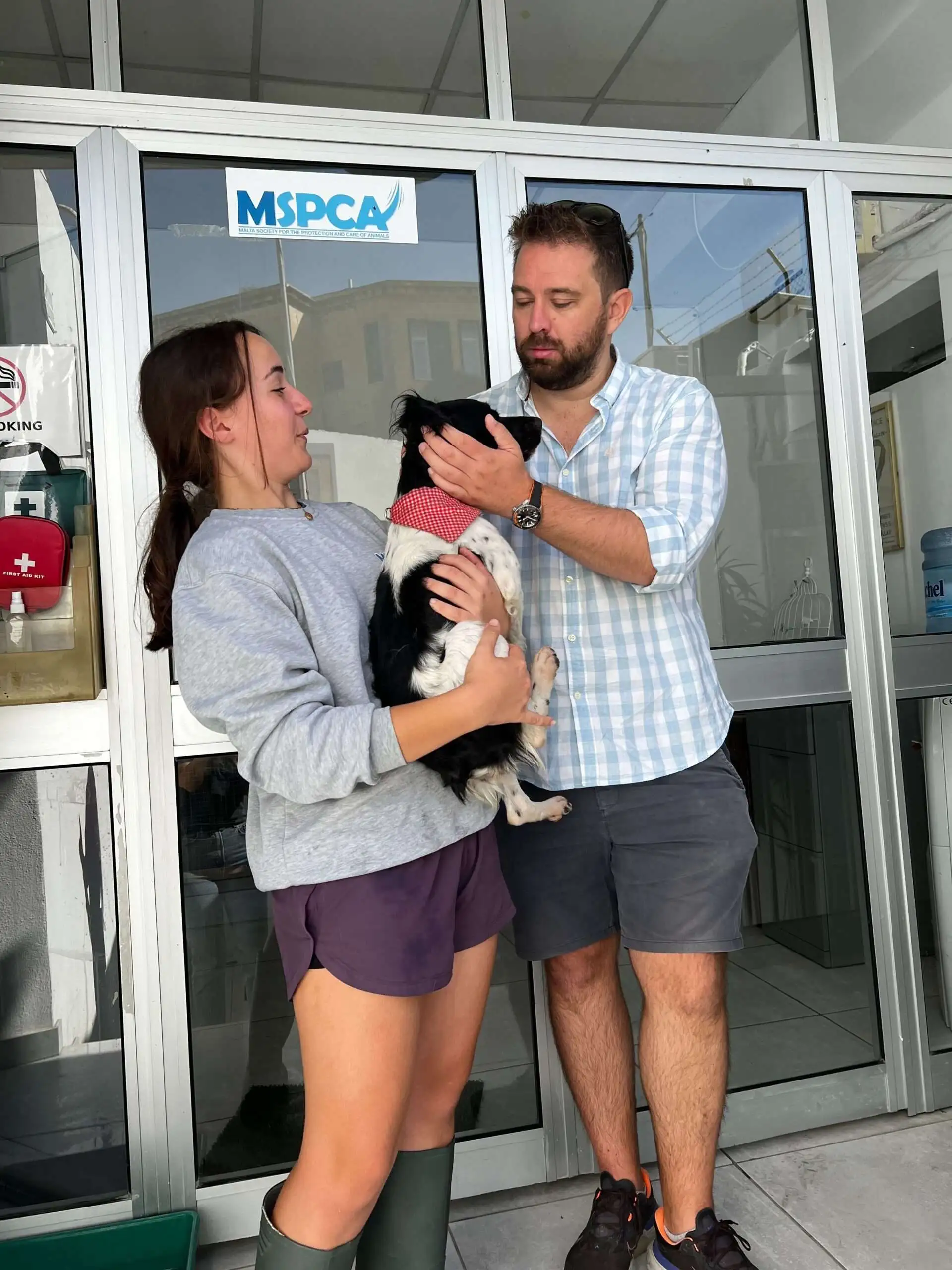 White Label Casinos CEO, Phil Pearson, visits the MSPCA animal shelter in Malta and holds a dog.